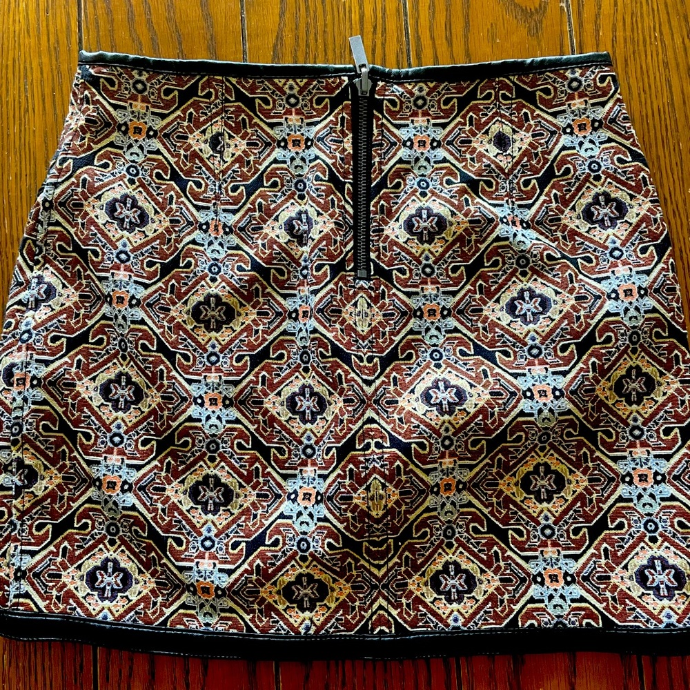 Express skirt with faux leather trim size 4. Worn once.